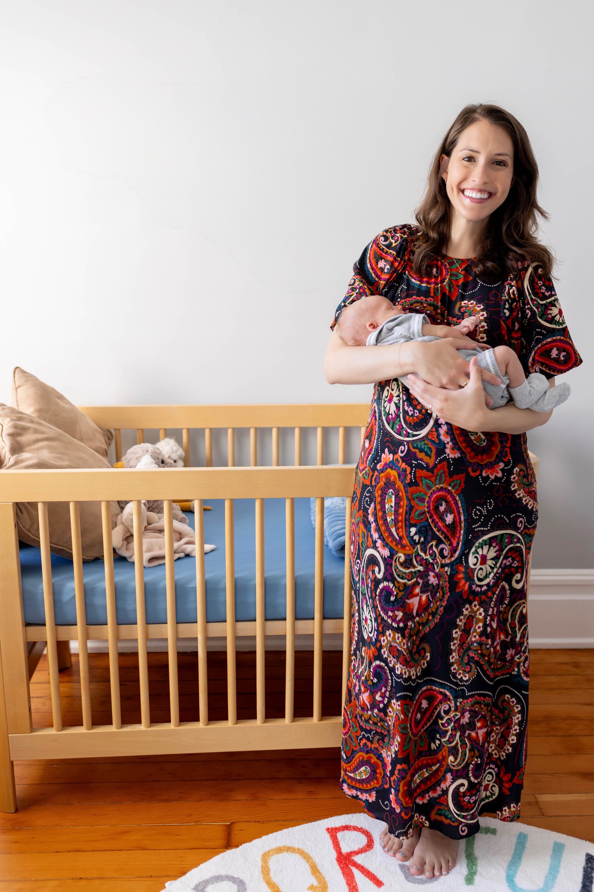NestPair founder holding her newborn
